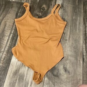 Tan Sleeveless Bodysuit with Scoop Neckline
